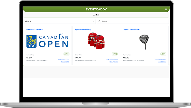 Laptop displaying Event Caddy auction software with bid tracking and item management