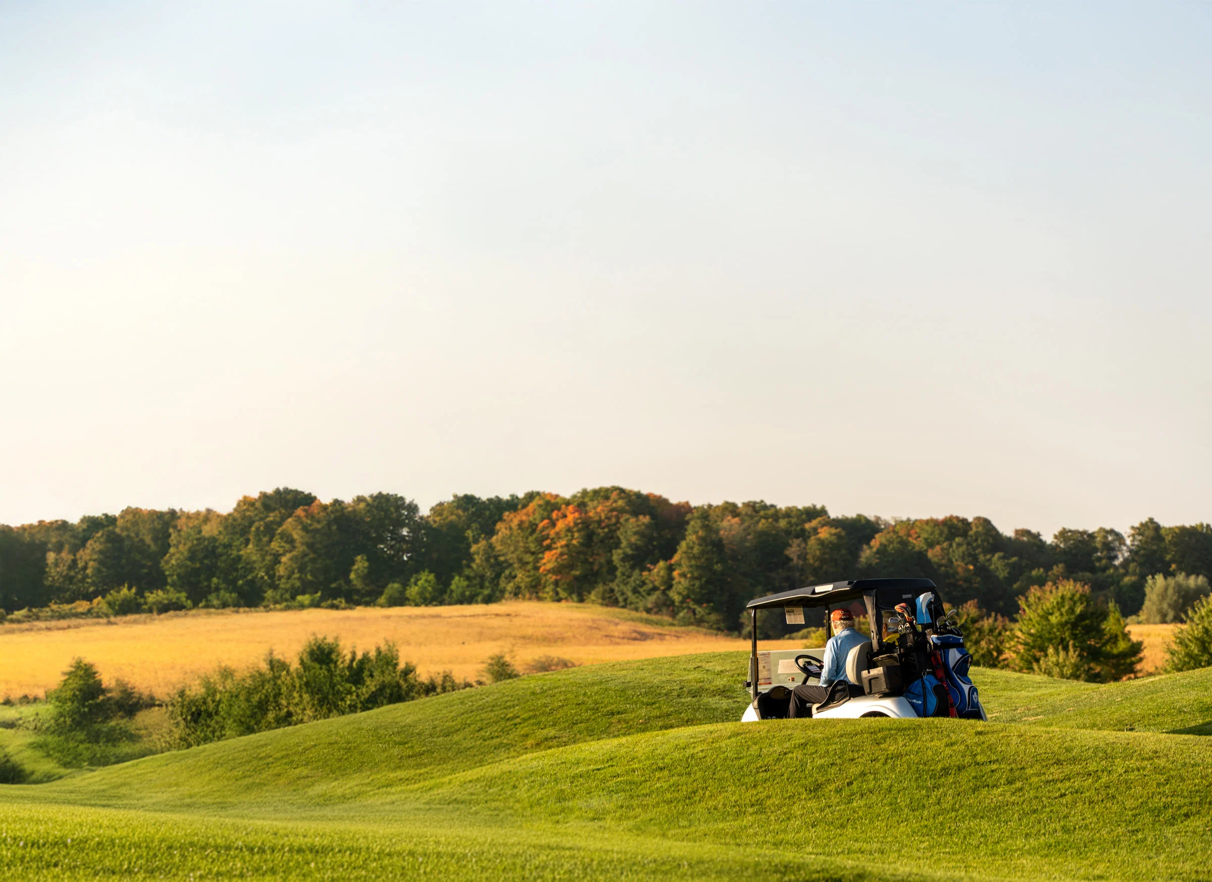 Golfers gathered at a tournament fundraiser on the course.