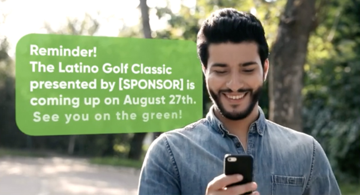 Male golfer looking down at his phone with message bubble